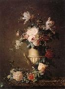 A Still life of various flowers in a sculpted urn,resting on a marble-topped table unknow artist